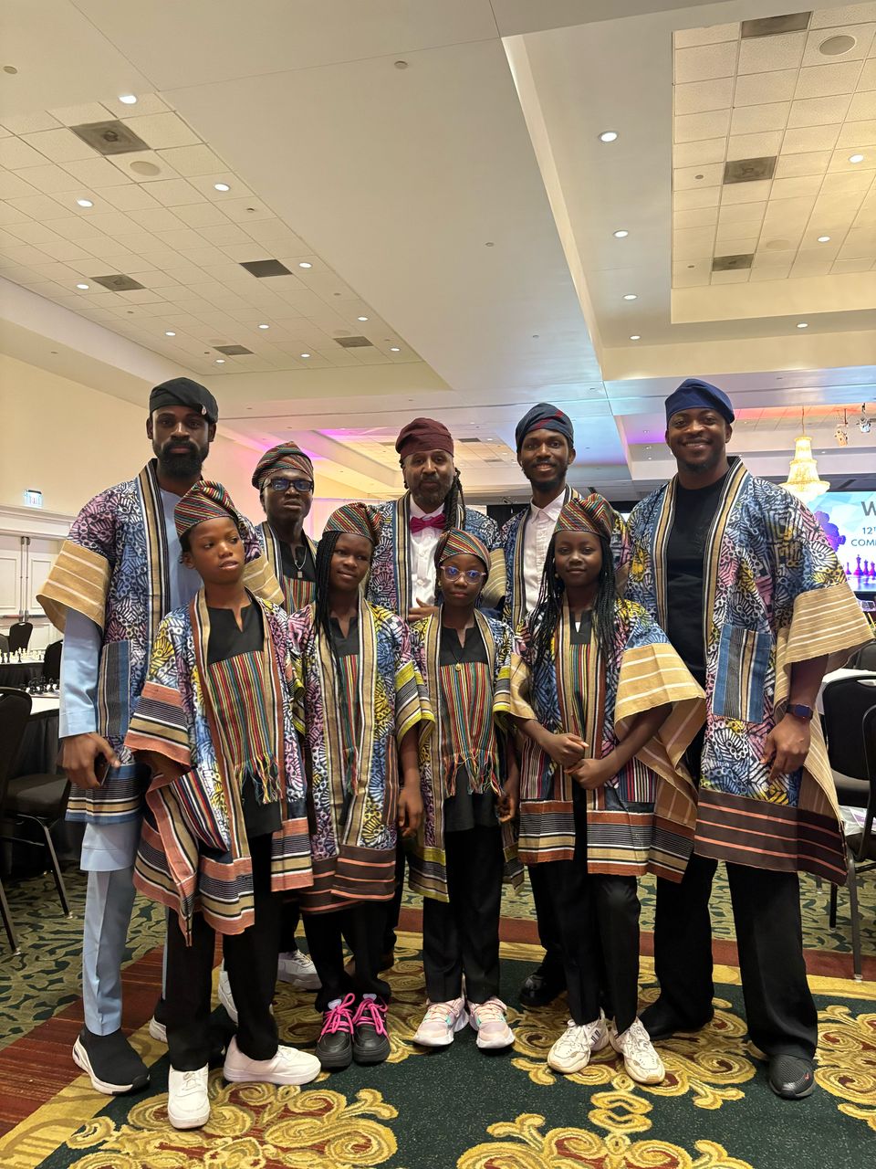 Toluwalase Eniola with a cultural delegation at an international gathering